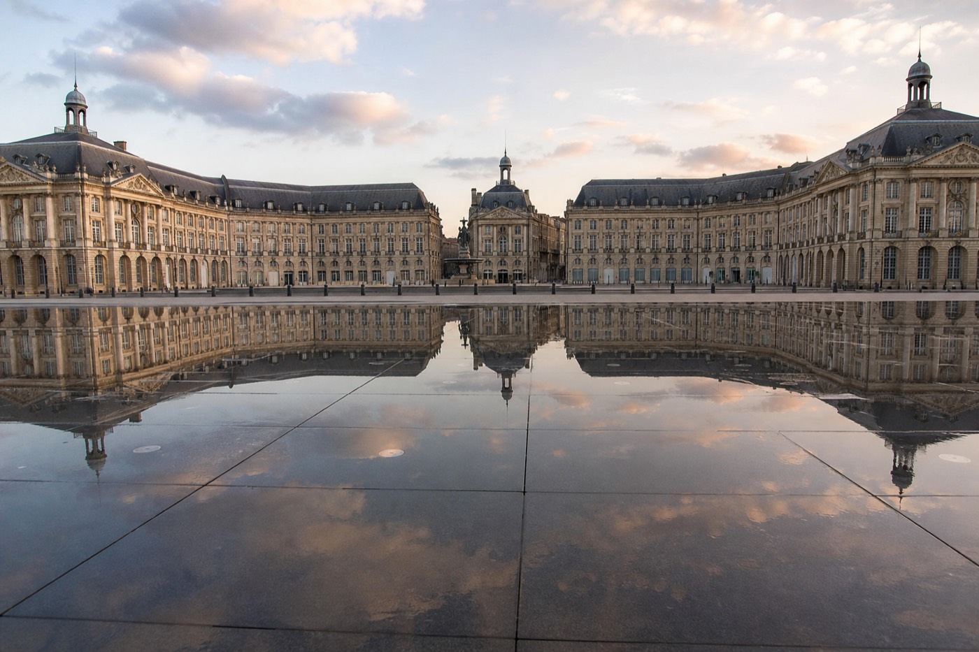 The water mirror fountain reflecting the Place de la Bourse facade on the Bordeaux riverfront